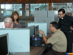 Fuad, Alma, David, and Father Samer surfing the Internet (rw)