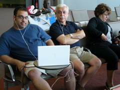 Karim and Bill watch Superman Returns, while Nina reads (rw)