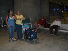 Nicole, ann, and Karim wait for hotel shuttle bus during our Paris overnight layover (rw)