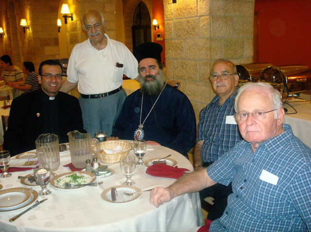 Father Samer, Naim, Subi, and Fuad with the Bishop, in the dining hall at Notre Dame Jerusalem Center (sy)