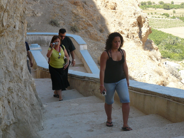 Nina, Father Samer, and Ursula climb to the Monastery of the Mount of Temptation (rw)