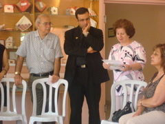 Subi, Father Samer, and Alma listening at the Four Homes of Mercy in Bethany (sy)
