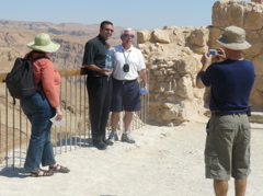 Salim takes picture of Ann, Father Samer, and Bill, at Masada (rw)