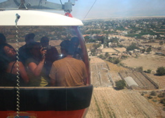 Taking the cable car to Mount Temptation, with Jerico behind and below (sy)