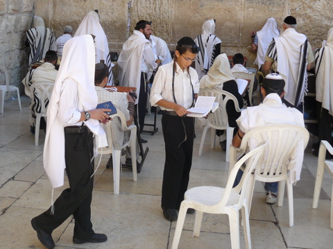 Young men praying at the left edge of the West Wall (rw)