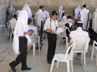 Young men praying at the left edge of the West Wall (rw)