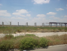 Roman Aquaduct?  No, new elevated light rail line under construction in the countryside (sy)