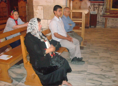 Oum Fadi, Paul, and George in the congregation an St. Elias Church, Jerusalem (sy)