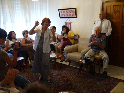 Widad dances while Naim sings, at Naim's house (rw)