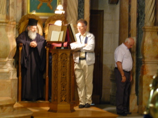 Reading during the Orthos service, midnight at the Church of the Holy Sepulchre (rw)