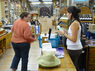 Ann doing price check at the Yardenit gift shop (rw)