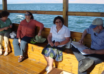 Boat ride on Sea of Galilee - Lilian, Ann, Rafiha, and Robert reading the Illustrated Atlas of Jerusalem (sy)