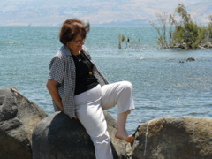 Widad wades in the Sea of Galilee at Tabgha (rw)