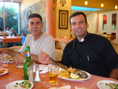 Salim and Father Samer having lunch of St. Peter's Fish at Turanteen (sy)