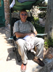 George taking his ease in the attendant's chair at the shrine to Elijah the prophet vanquishing the priests of Baal, Mount Carmel (rw)